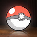 Front view of Pokeball LED lightbox sign glowing on a wooden desk