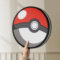 Unlit Pokeball LED lightbox held by hand to show size and details