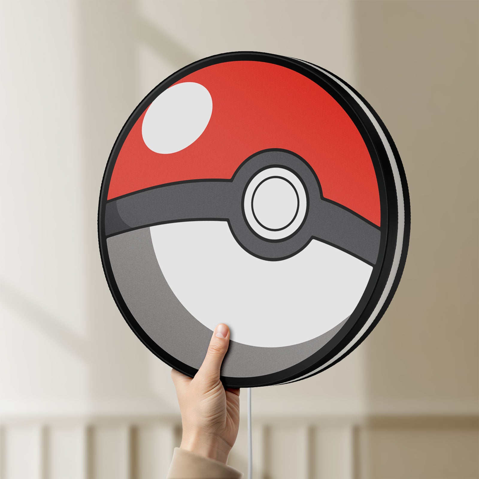 Unlit Pokeball LED lightbox held by hand to show size and details