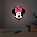 Minnie Mouse Head LED lightbox hanging on a room wall with soft pink light