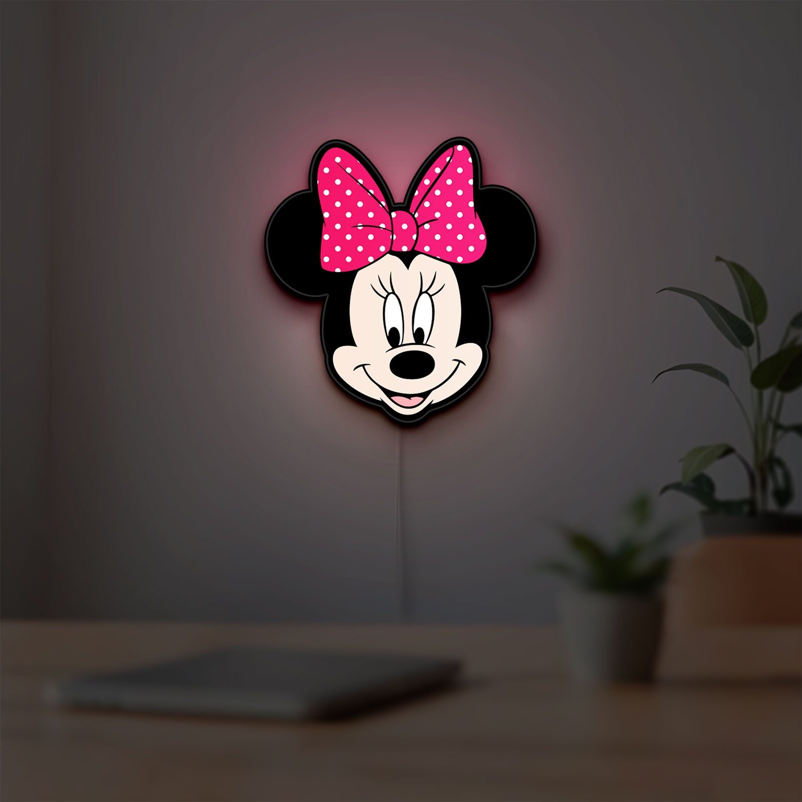 Minnie Mouse Head LED lightbox hanging on a room wall with soft pink light