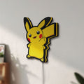 Unlit Pikachu LED lightbox mounted on a wall in daylight
