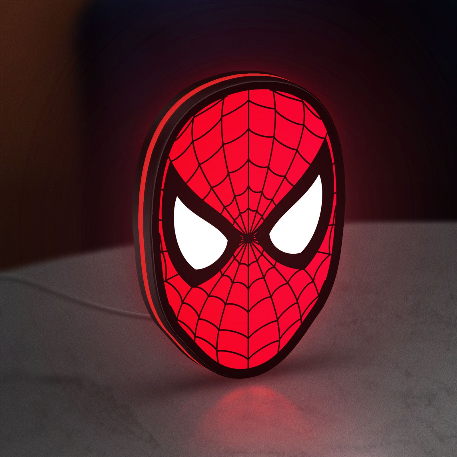 Spider-Man LED lightbox standing on a desk from an angled side view with red glow