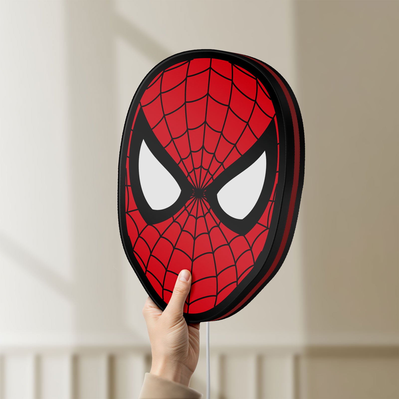Unlit Spider-Man LED lightbox held by hand to show size and details
