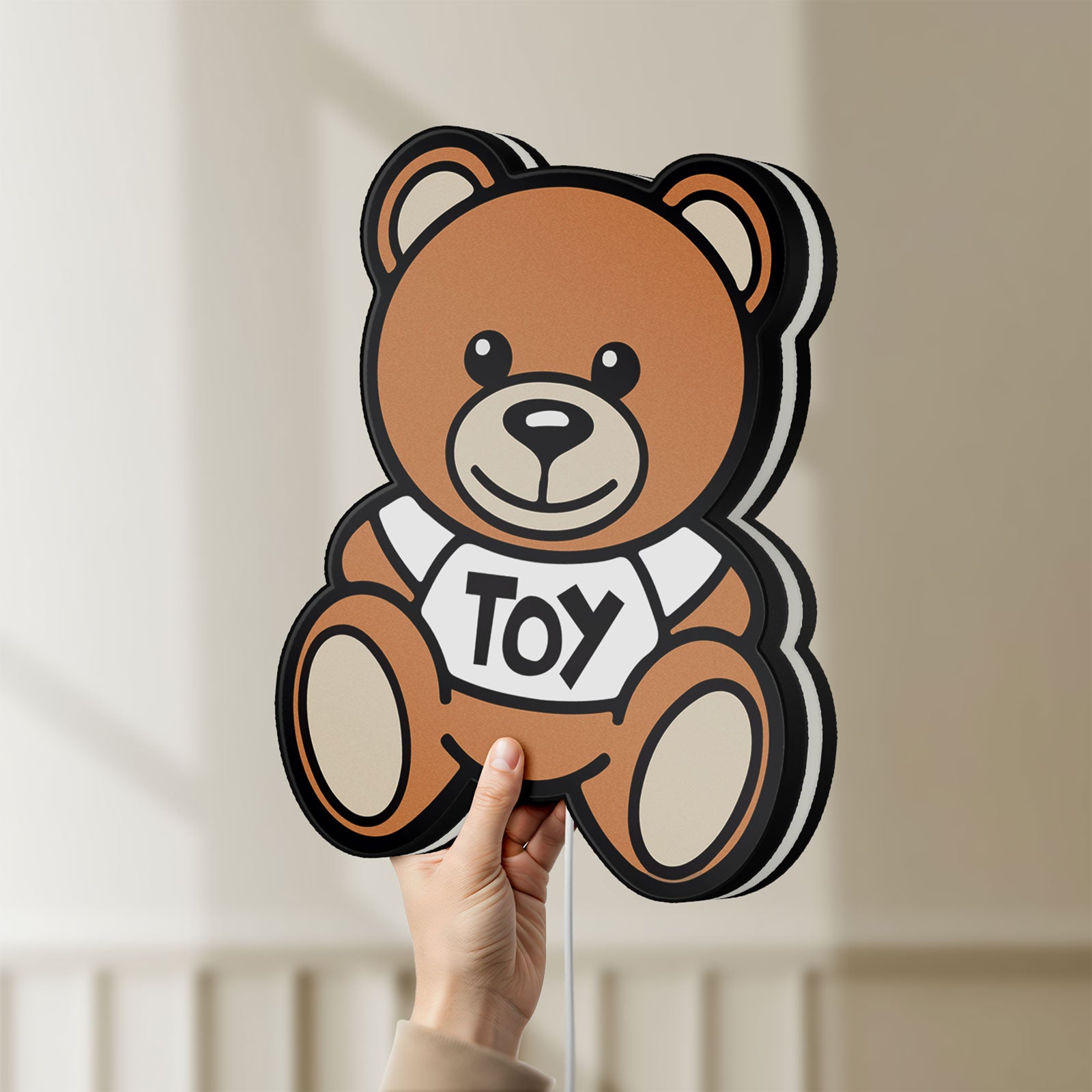 Unlit Oso Moschino Toy LED lightbox held by hand to show size and details