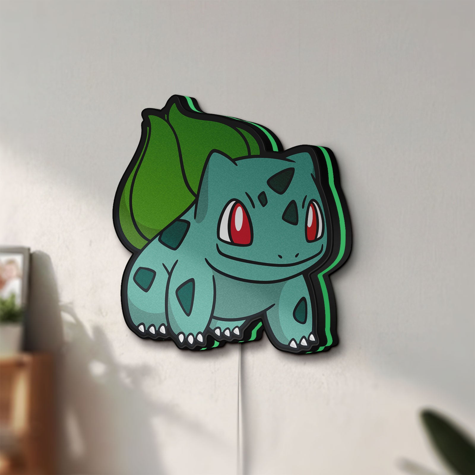 Unlit Bulbasaur LED lightbox mounted on a wall in daylight