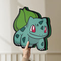 Unlit Bulbasaur LED lightbox held by hand to show size and details