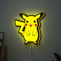 Pokemon LED lightbox hanging on a wall with yellow glow
