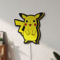 Unlit Pokemon LED lightbox mounted on a wall in daylight