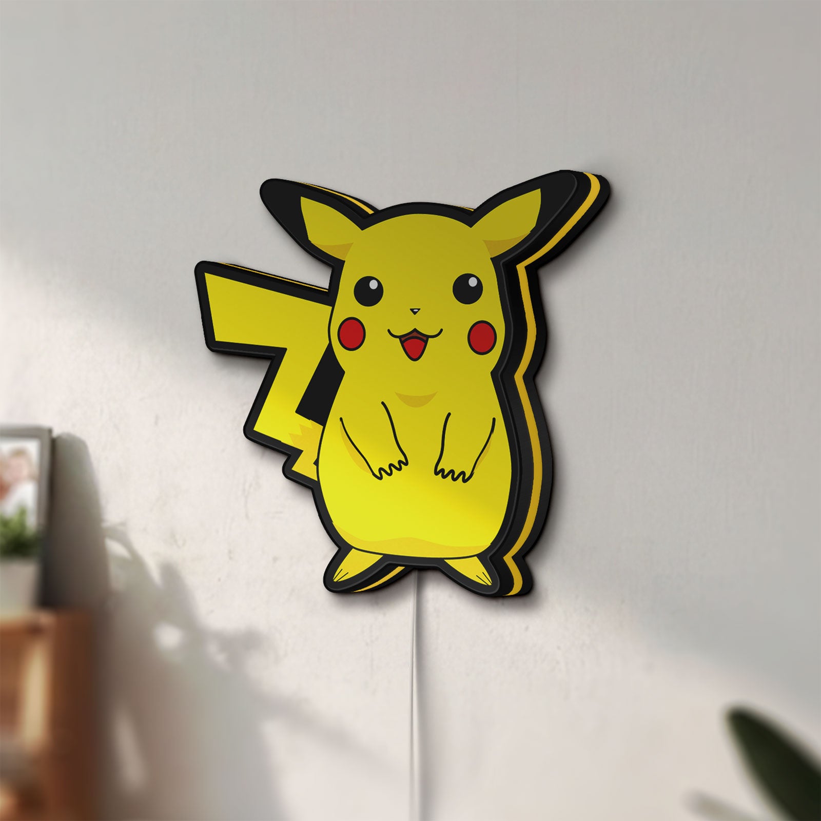 Unlit Pokemon LED lightbox mounted on a wall in daylight