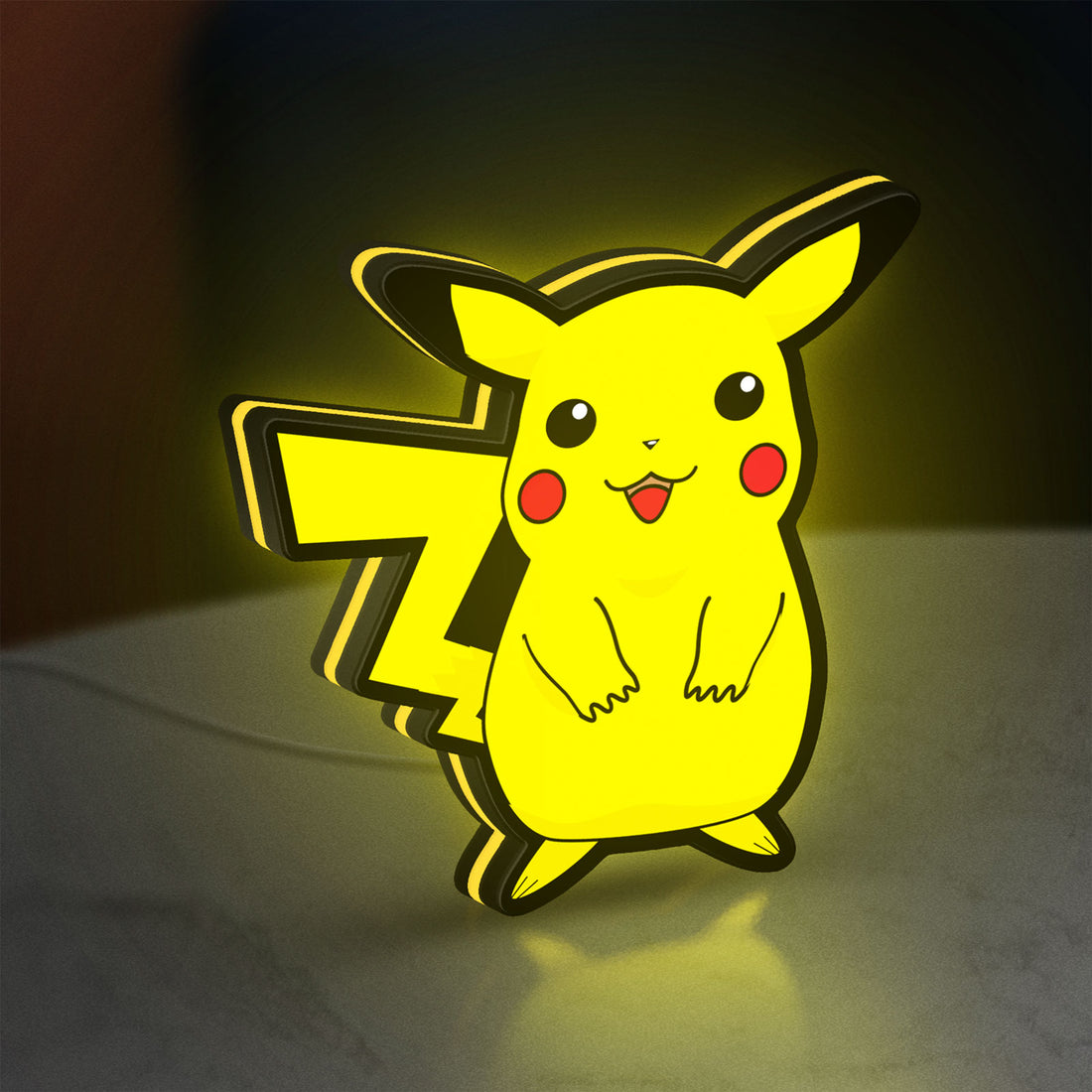 Pokemon LED lightbox hanging on a wall with yellow glow