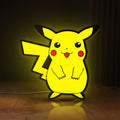 Front view of Pokemon LED lightbox sign glowing on a wooden desk