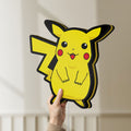 Unlit Pokemon LED lightbox held by hand to show size and details