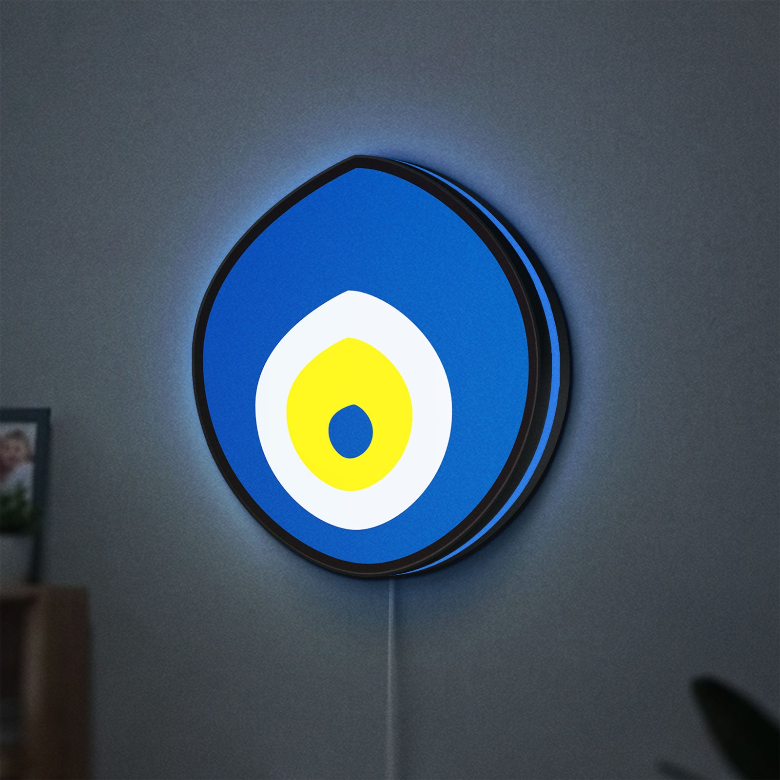 Nazar Boncugu LED lightbox hanging on a wall with blue glow