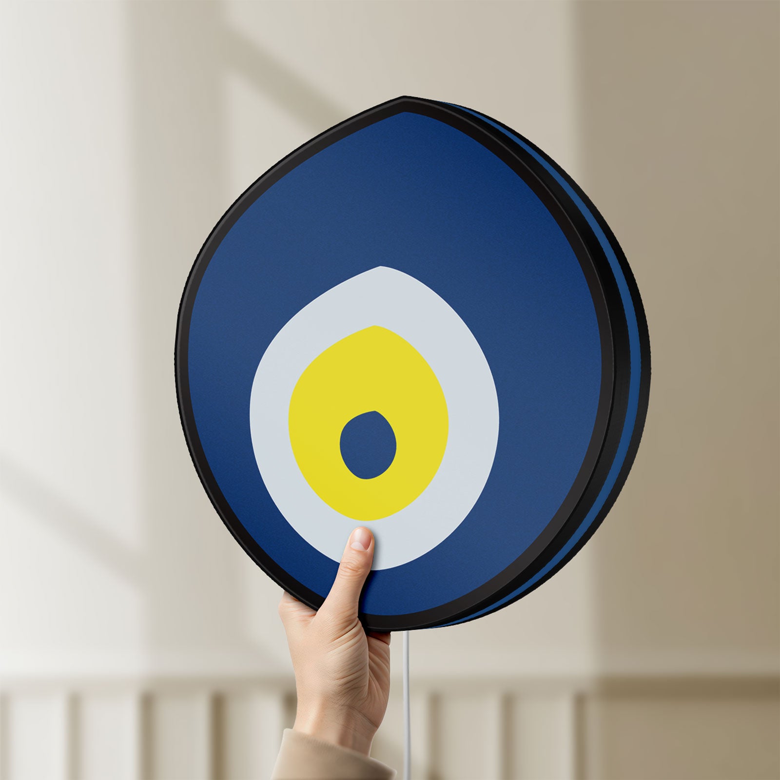 Unlit Nazar Boncugu LED lightbox held by hand to show size and details