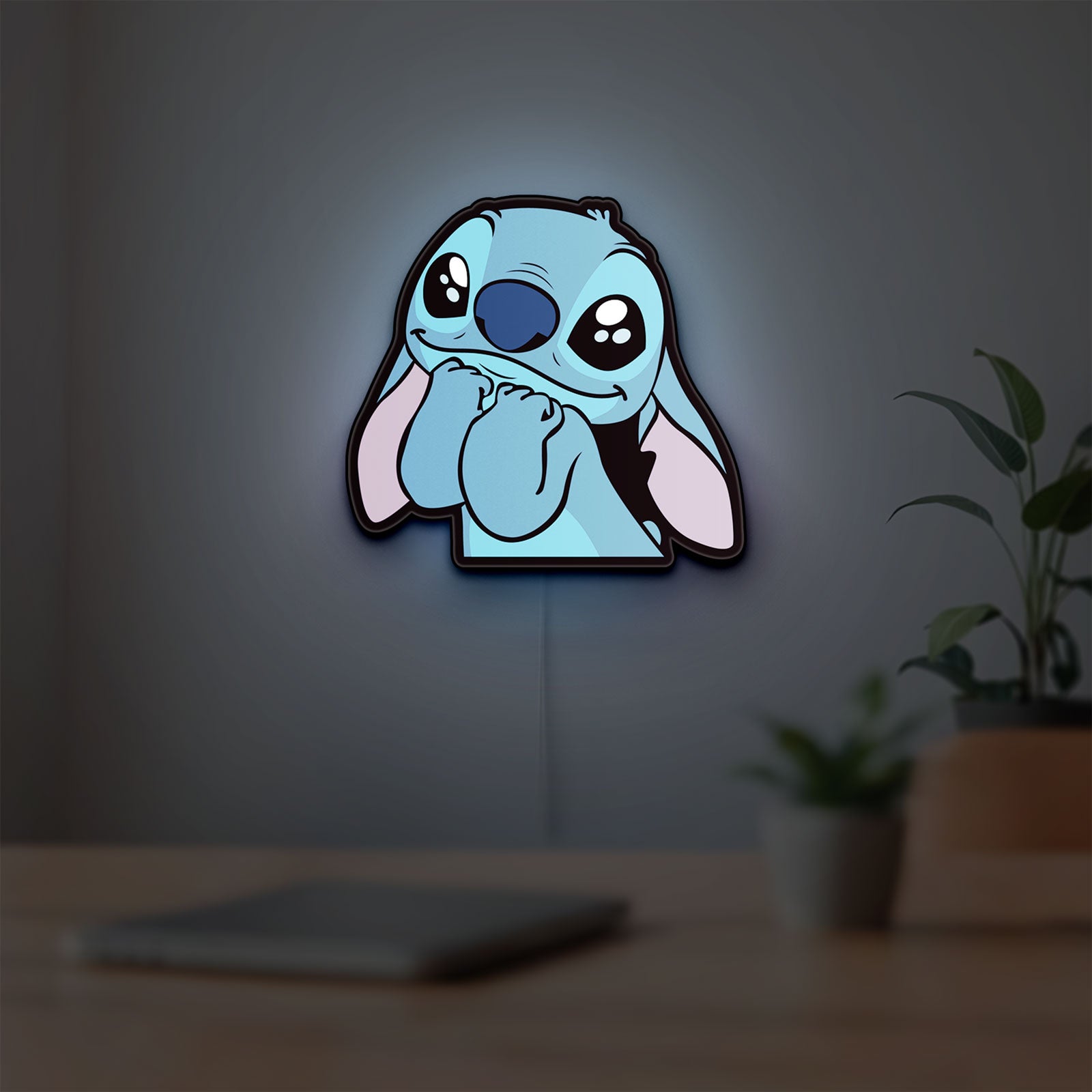 Lilo & Stitch LED lightbox hanging on a room wall with soft blue light