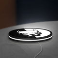 Pitbull Syndicate LED lightbox lying flat on a desk with white glow