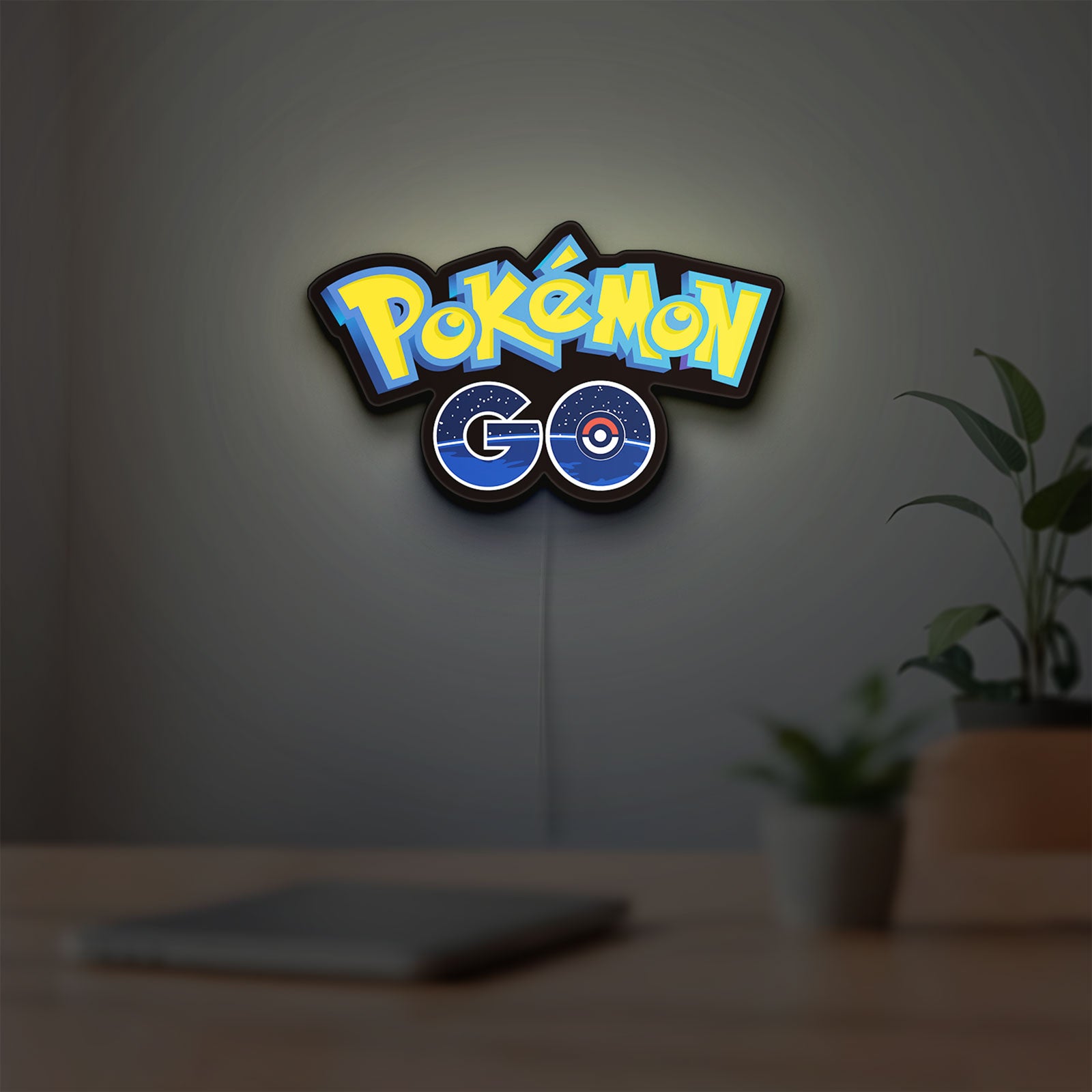 Pokemon GO LED lightbox hanging on a room wall with soft blue light