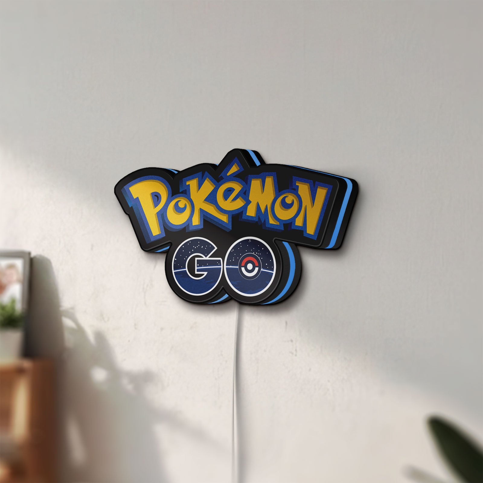 Unlit Pokemon GO LED lightbox mounted on a wall in daylight