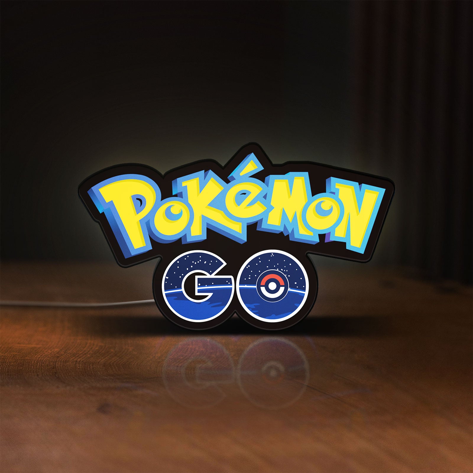 Front view of Pokemon GO LED lightbox sign glowing on a wooden desk