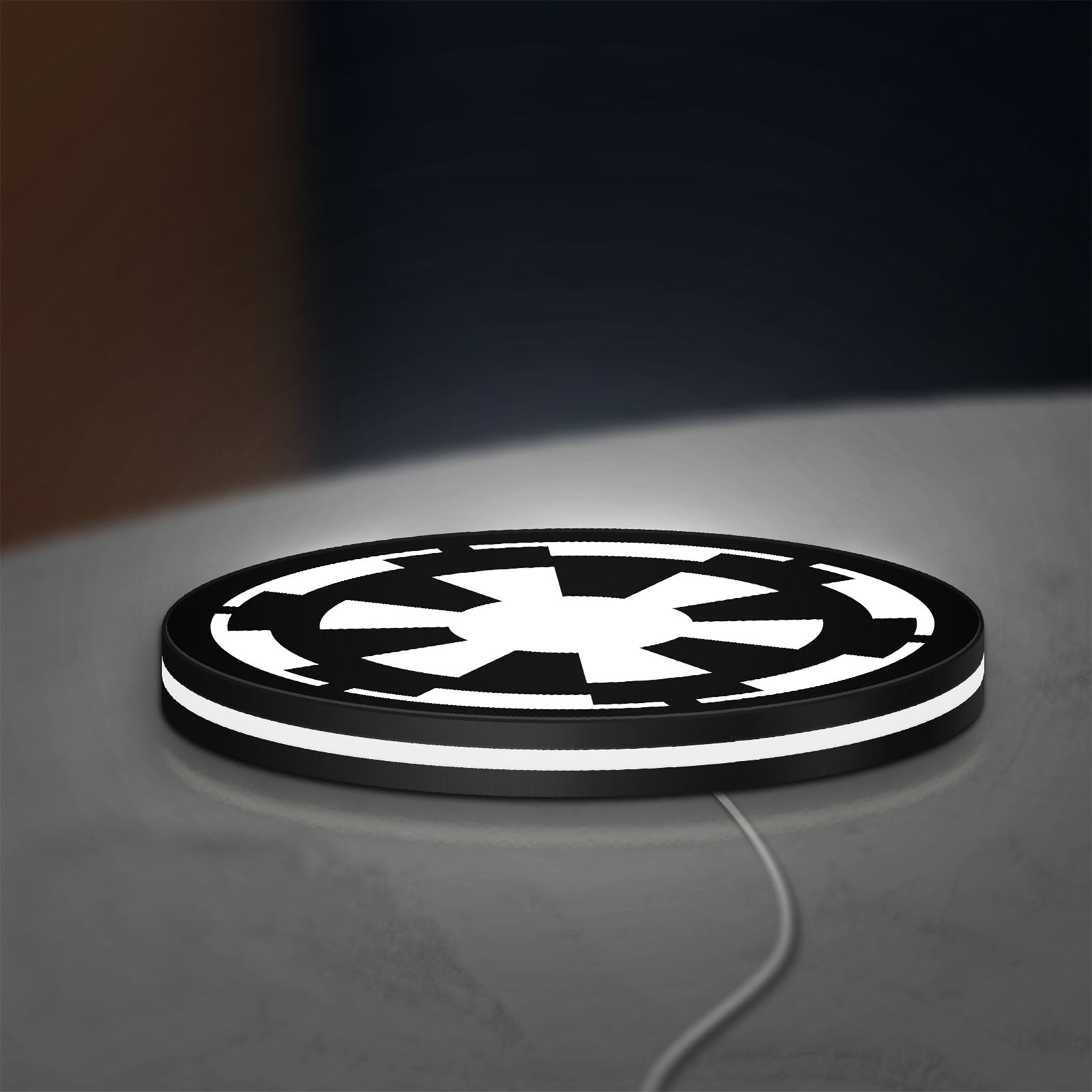Galactic Empire LED lightbox lying flat on a desk with white glow