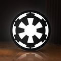 Front view of Galactic Empire LED lightbox sign glowing on a wooden desk