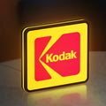 Kodak LED lightbox standing on a desk from an angled side view with yellow glow