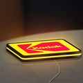 Kodak LED lightbox lying flat on a desk with yellow glow