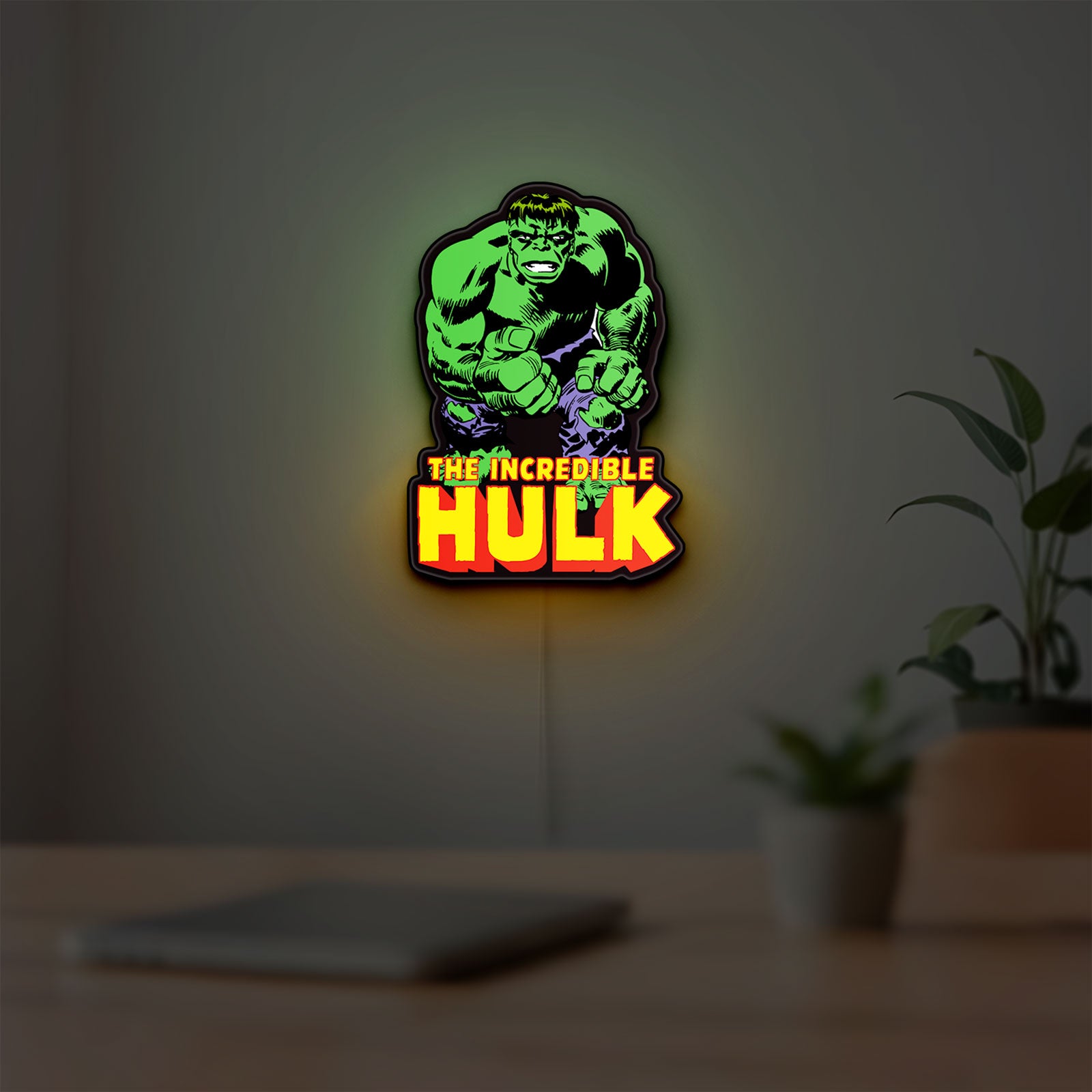 Hulk Smash Fist LED lightbox hanging on a room wall with soft green light