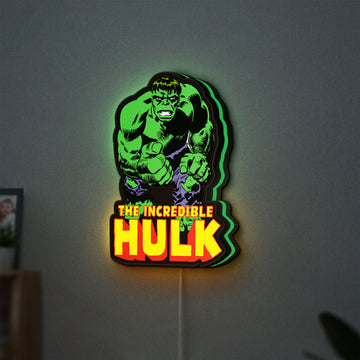 Hulk Smash Fist LED lightbox hanging on a wall with green glow