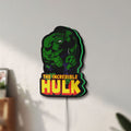 Unlit Hulk Smash Fist LED lightbox mounted on a wall in daylight
