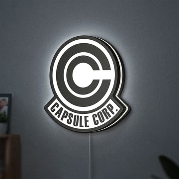 Capsule Corp LED lightbox hanging on a wall with white glow