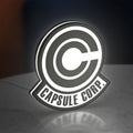 Capsule Corp LED lightbox standing on a desk from an angled side view with white glow