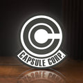 Front view of Capsule Corp LED lightbox sign glowing on a wooden desk