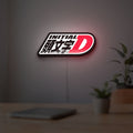 Initial D LED lightbox hanging on a room wall with soft white light