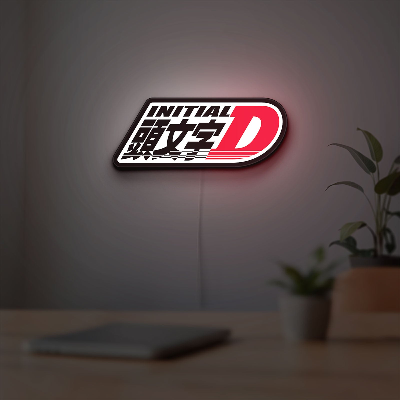 Initial D LED lightbox hanging on a room wall with soft white light