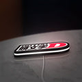 Initial D LED lightbox lying flat on a desk with white glow