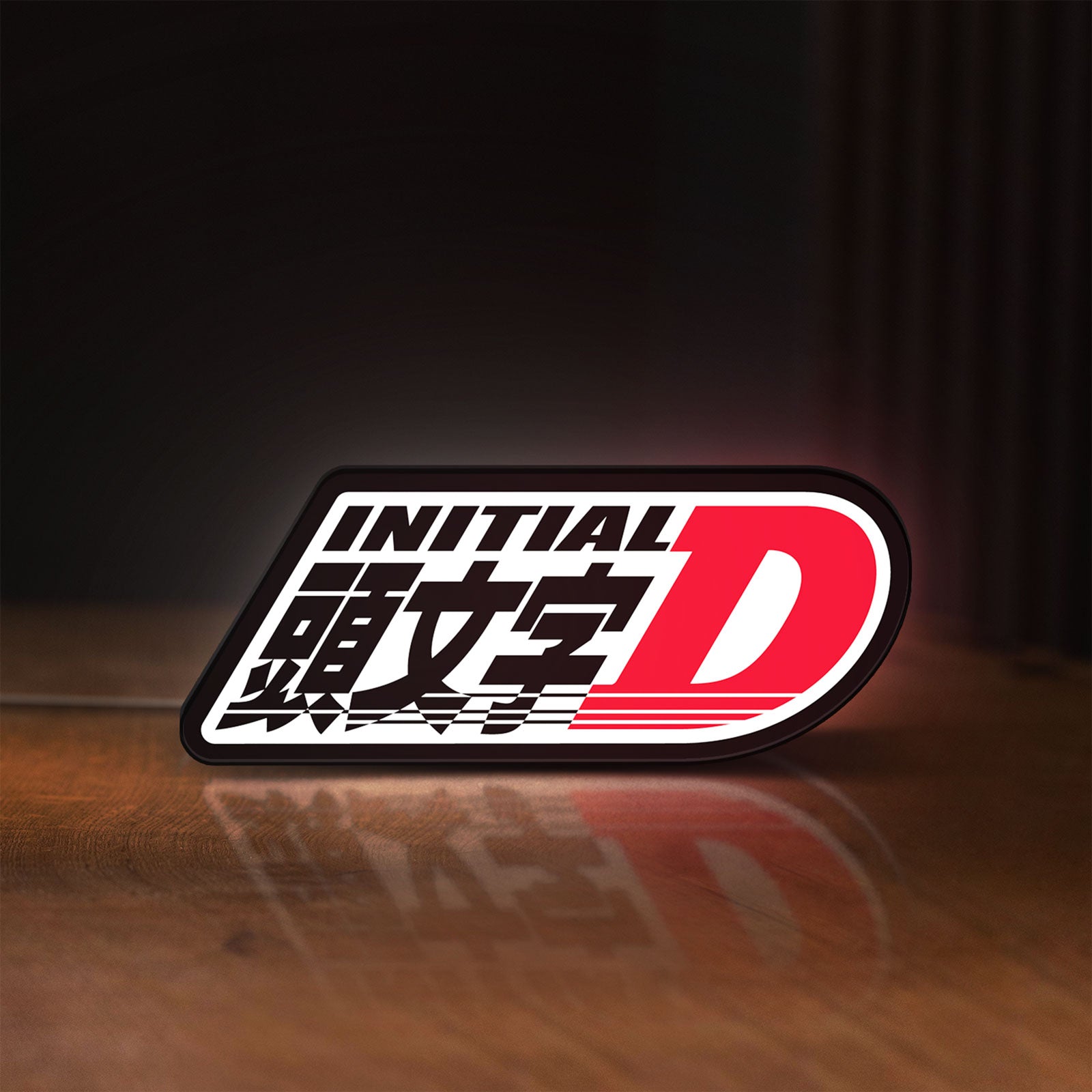Front view of Initial D LED lightbox sign glowing on a wooden desk