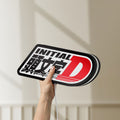 Unlit Initial D LED lightbox held by hand to show size and details