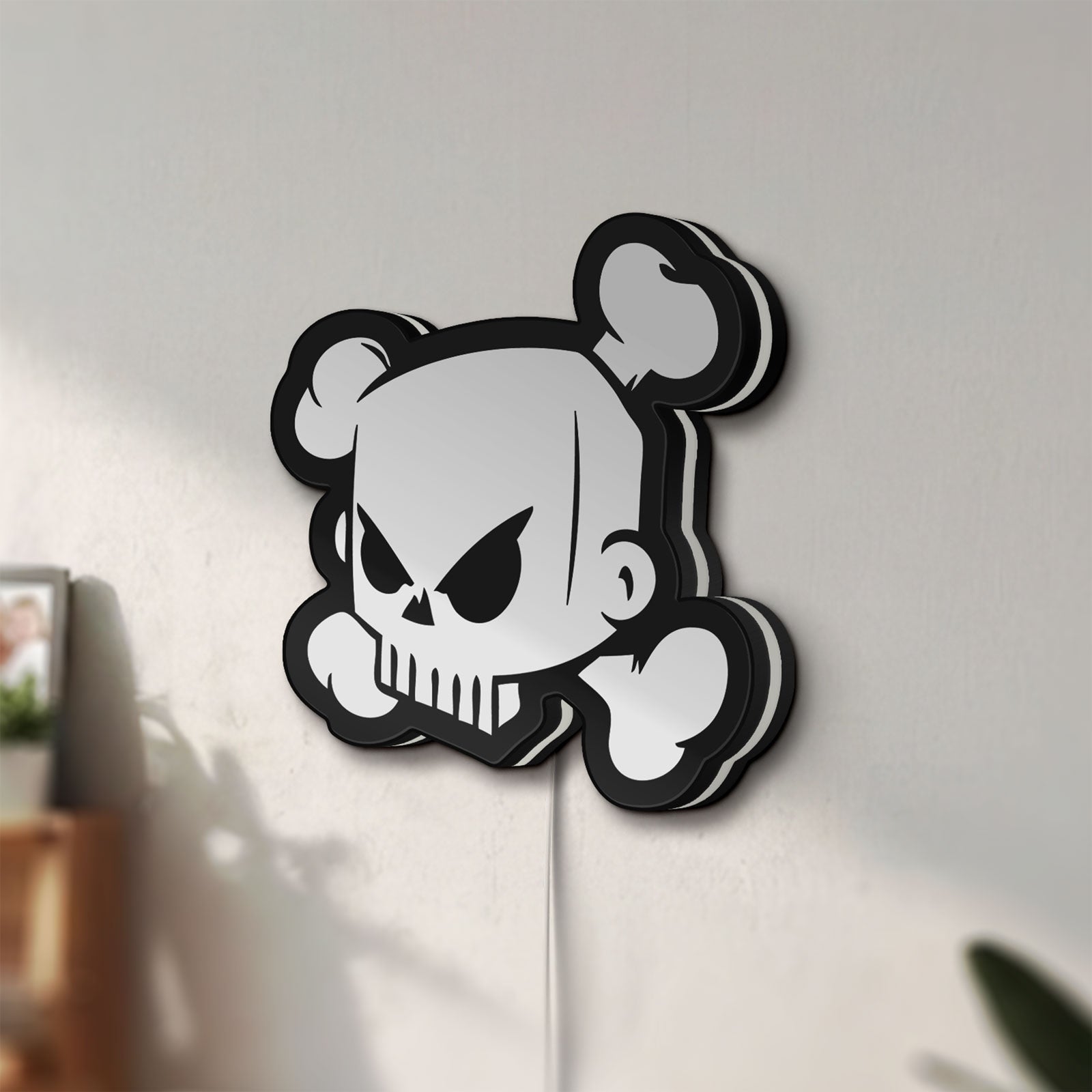 Unlit Ken Block Skull LED lightbox mounted on a wall in daylight