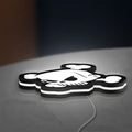Ken Block Skull LED lightbox lying flat on a desk with white glow