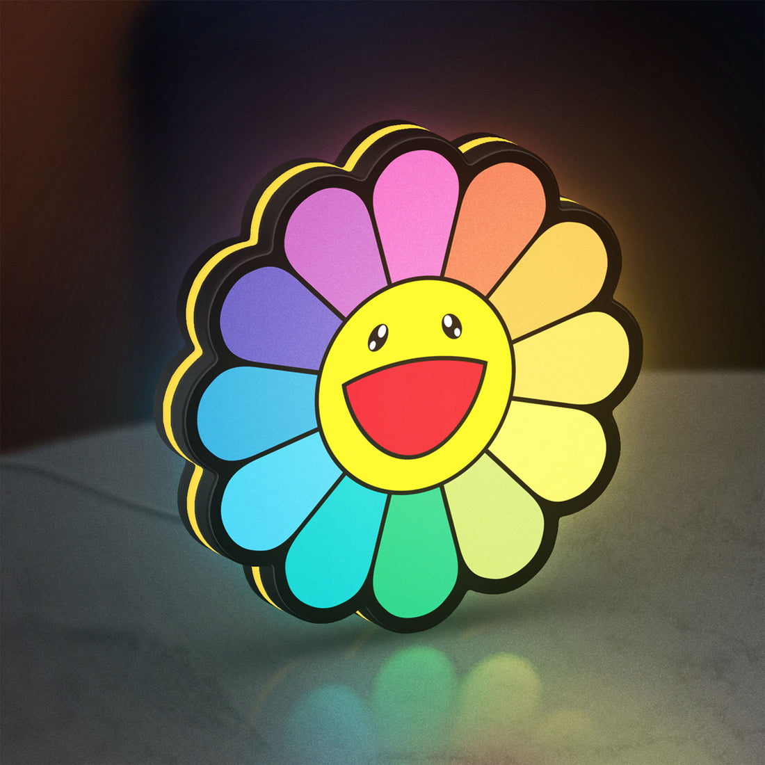 Takashi Murakami Rainbow Flower LED lightbox hanging on a wall with yellow glow