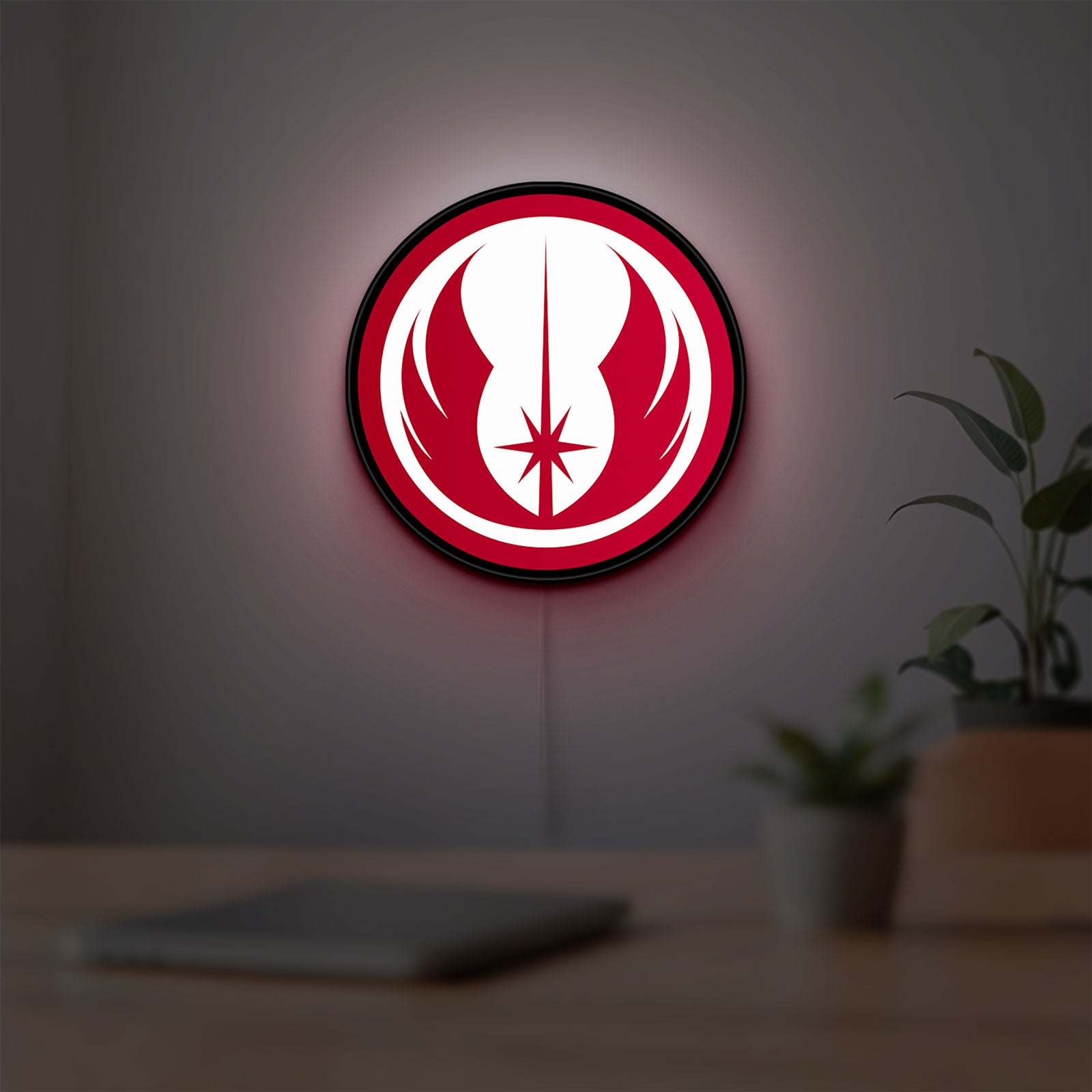 Jedi Order LED lightbox hanging on a room wall with soft red light