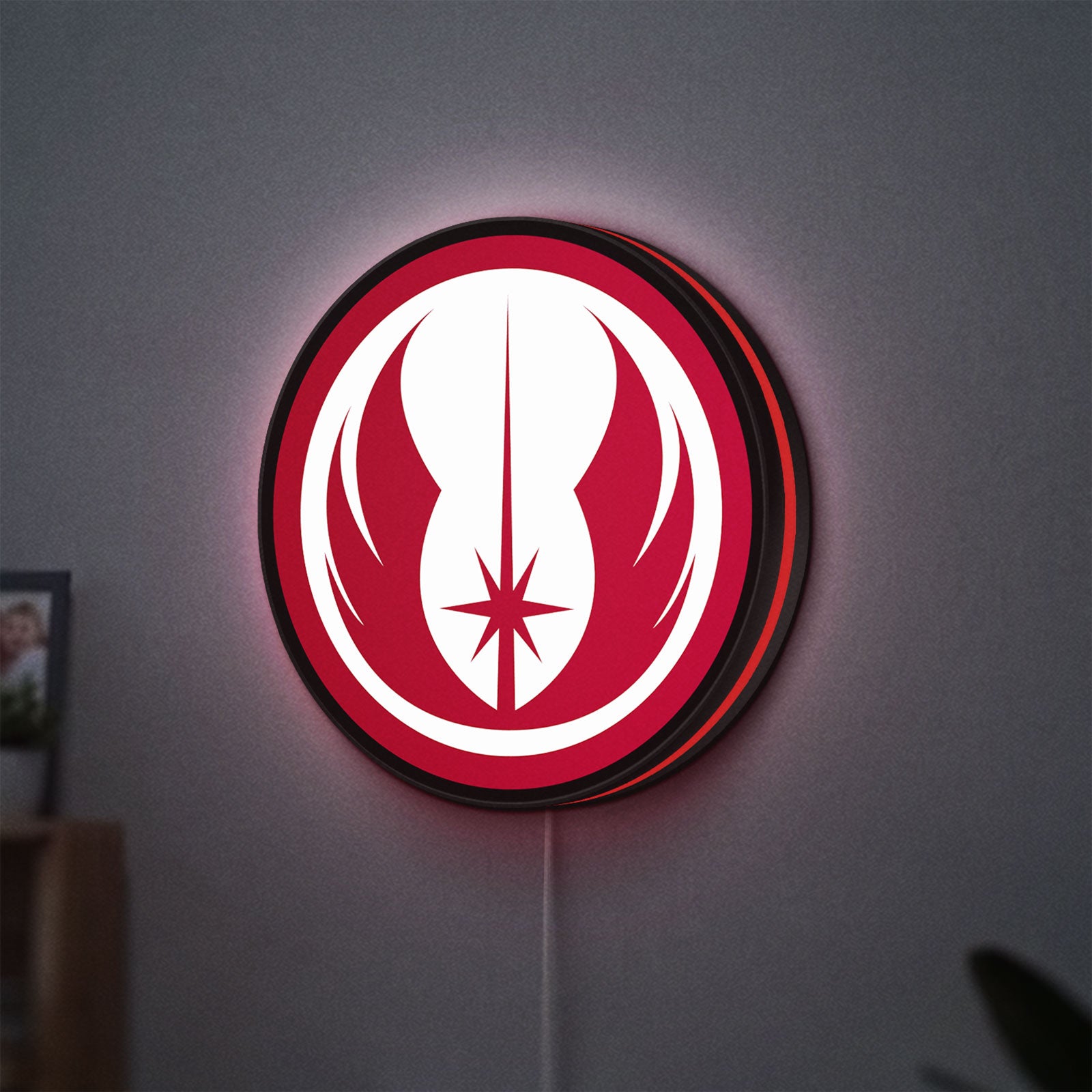 Jedi Order LED lightbox hanging on a wall with red glow