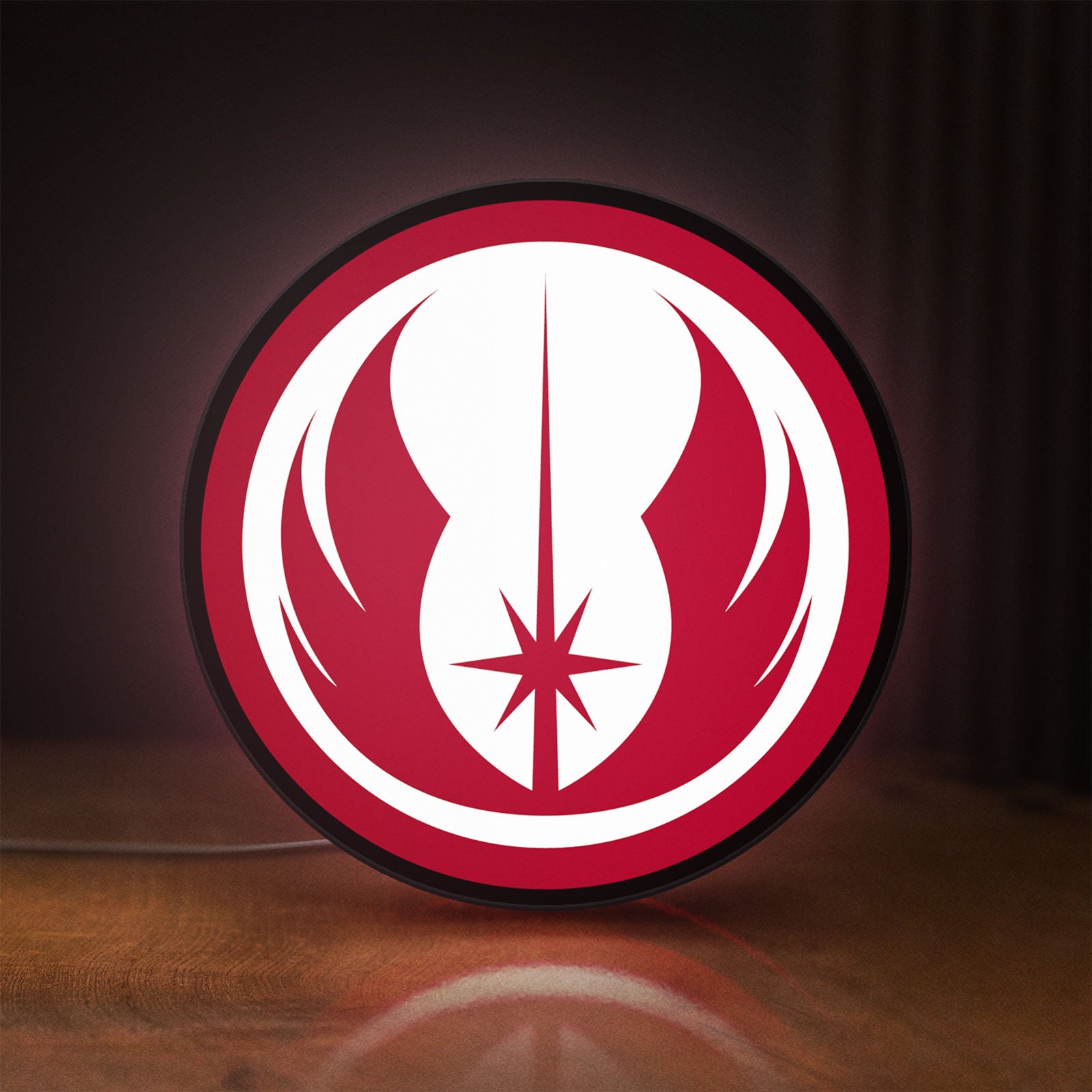 Front view of Jedi Order LED lightbox sign glowing on a wooden desk