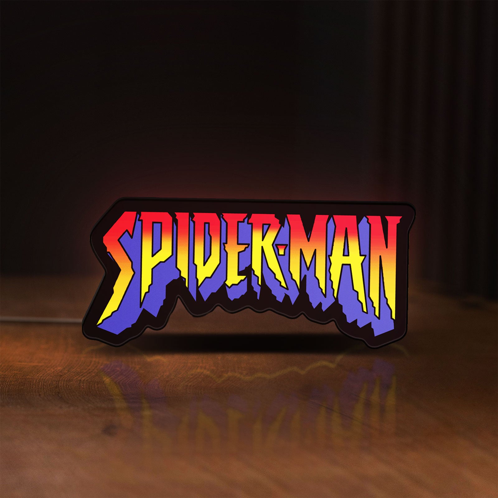 Front view of Spider-Man LED lightbox sign glowing on a wooden desk