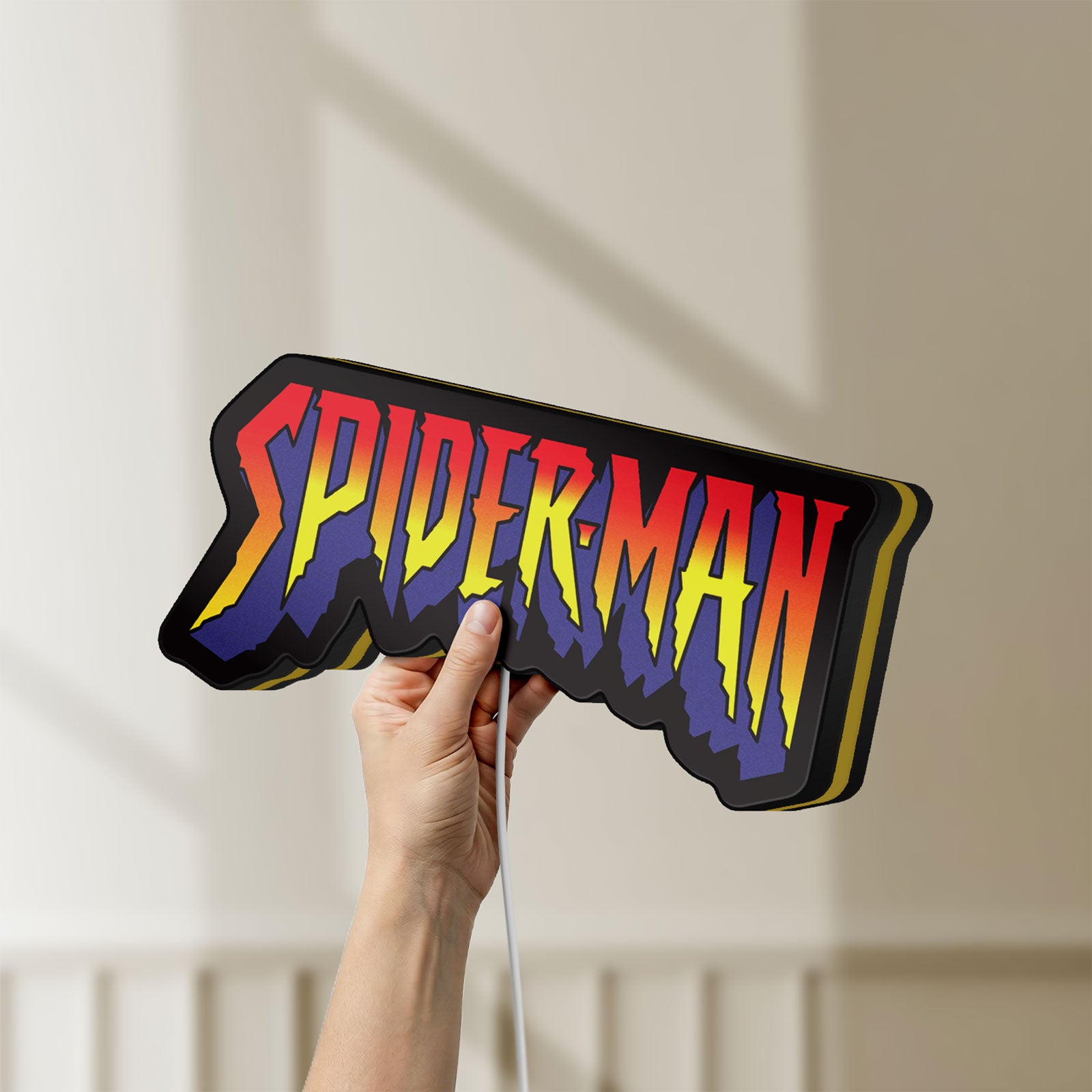 Unlit Spider-Man LED lightbox held by hand to show size and details