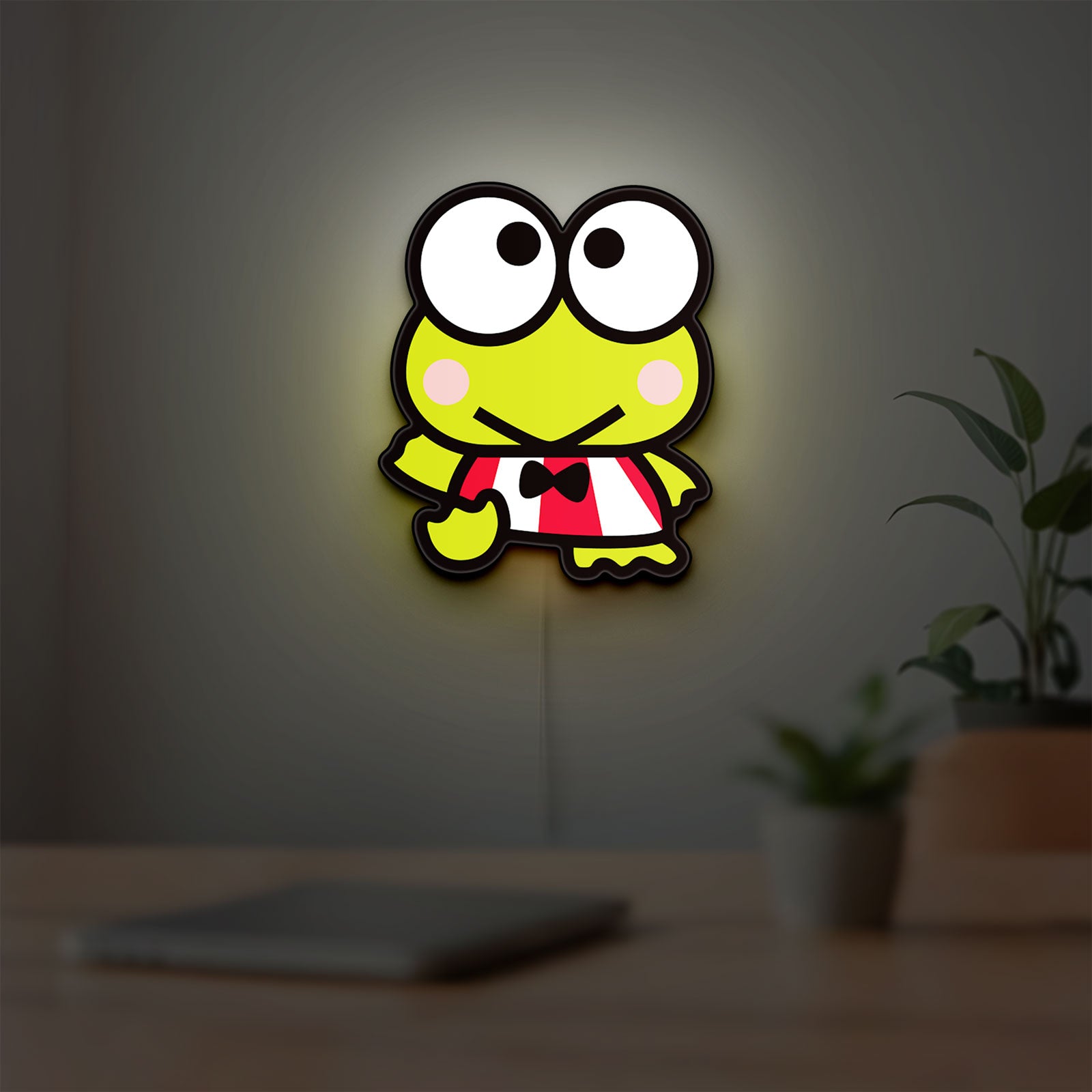 Keroppi LED lightbox hanging on a room wall with soft green light