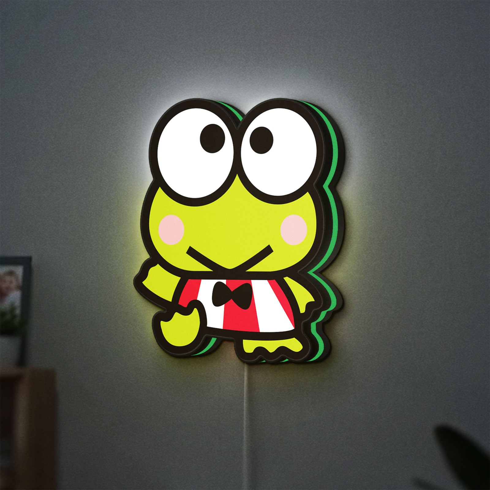 Keroppi LED lightbox hanging on a wall with green glow