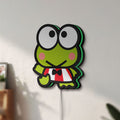 Unlit Keroppi LED lightbox mounted on a wall in daylight
